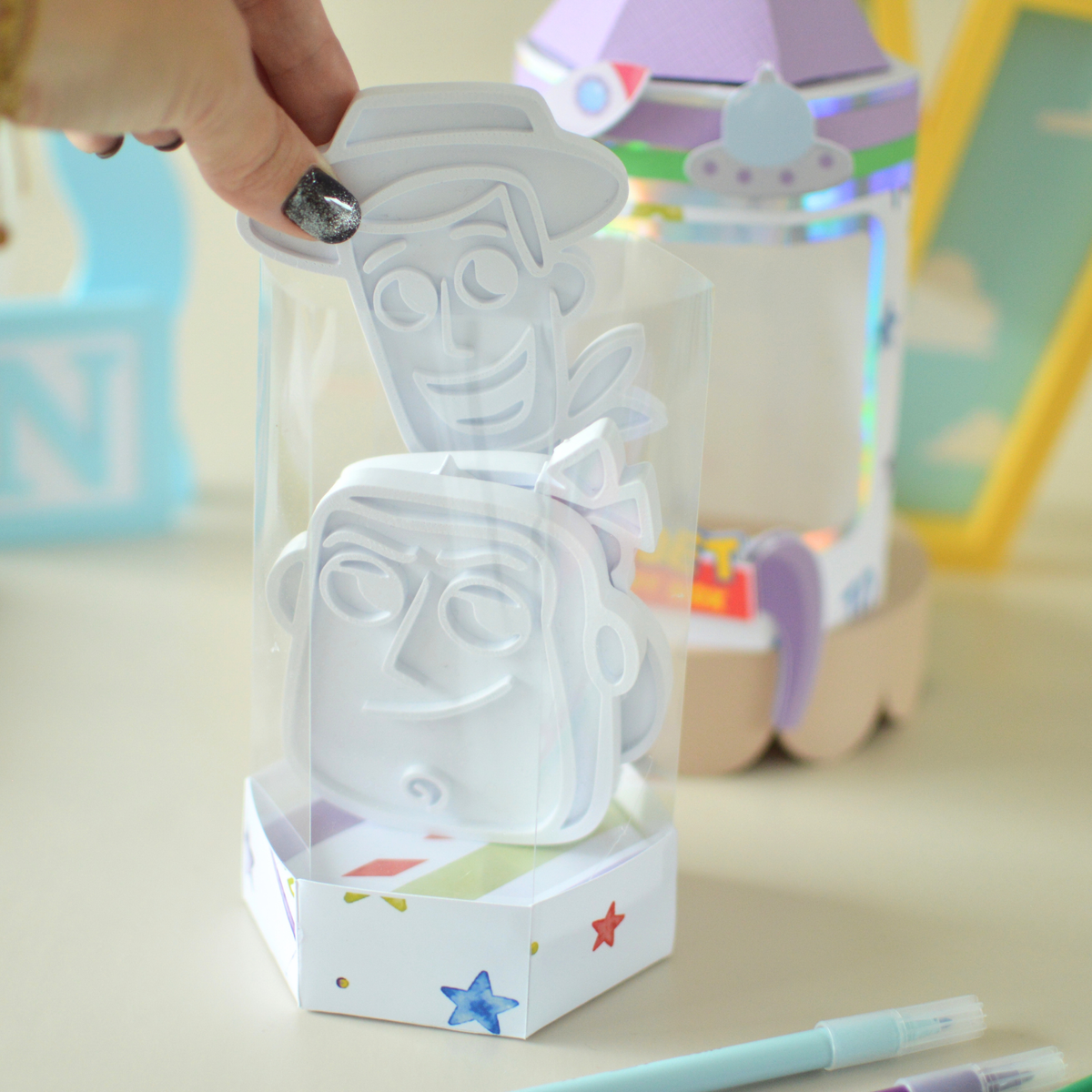 Colouring plates being placed inside the activity box