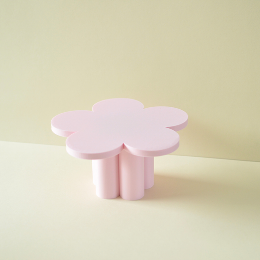Pink flower shaped cake plate on chunky round legs