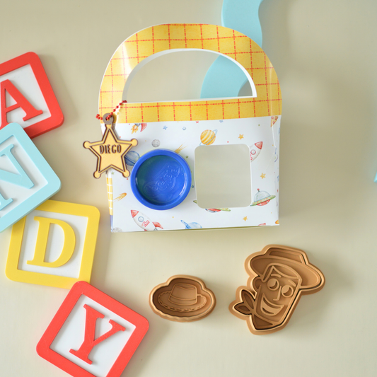 Kids party favour box with play dough and cookie cutters