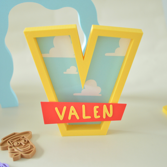 Personalised name letter for a kids room with red name banner