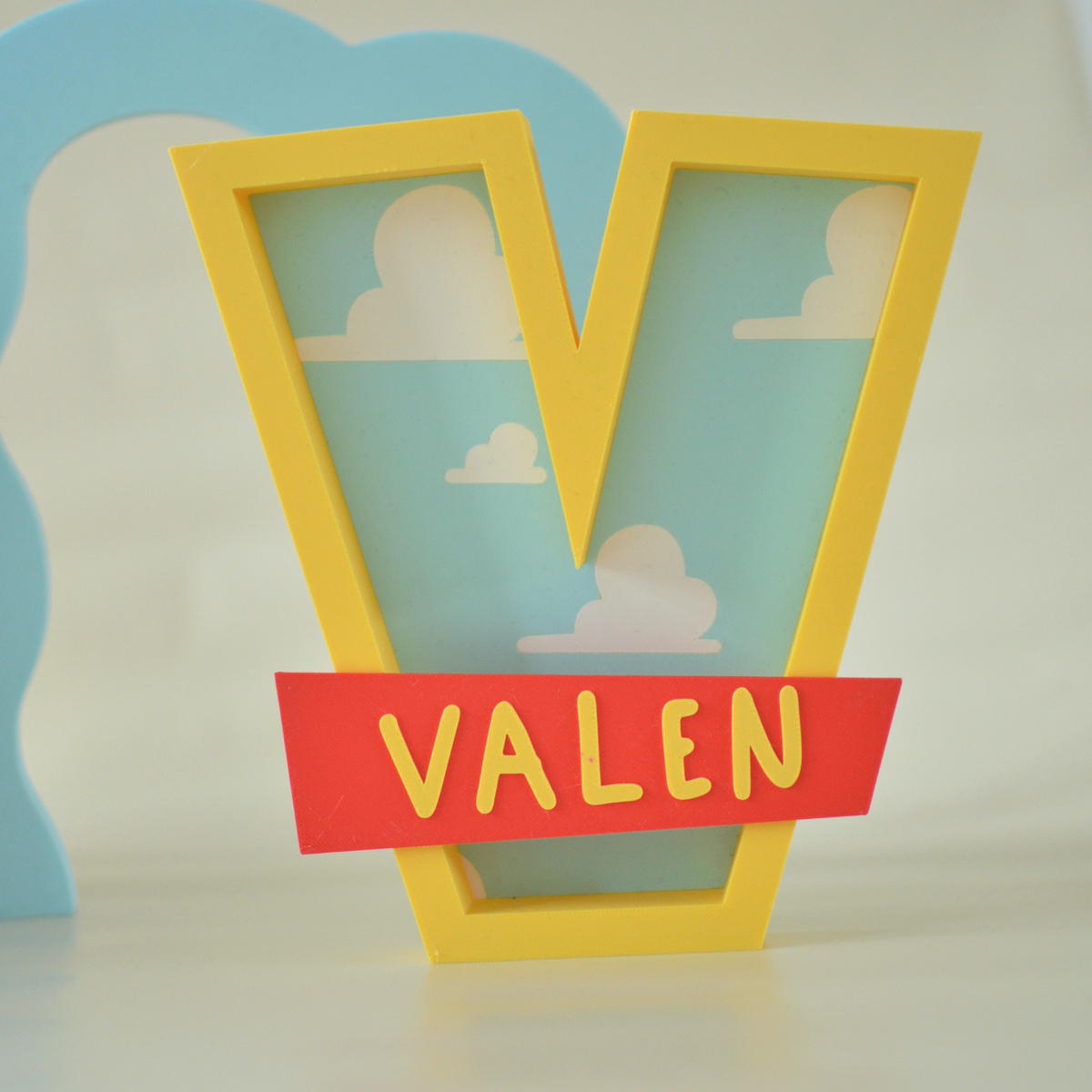 Close-up of a cloud print name letter with the name Valen