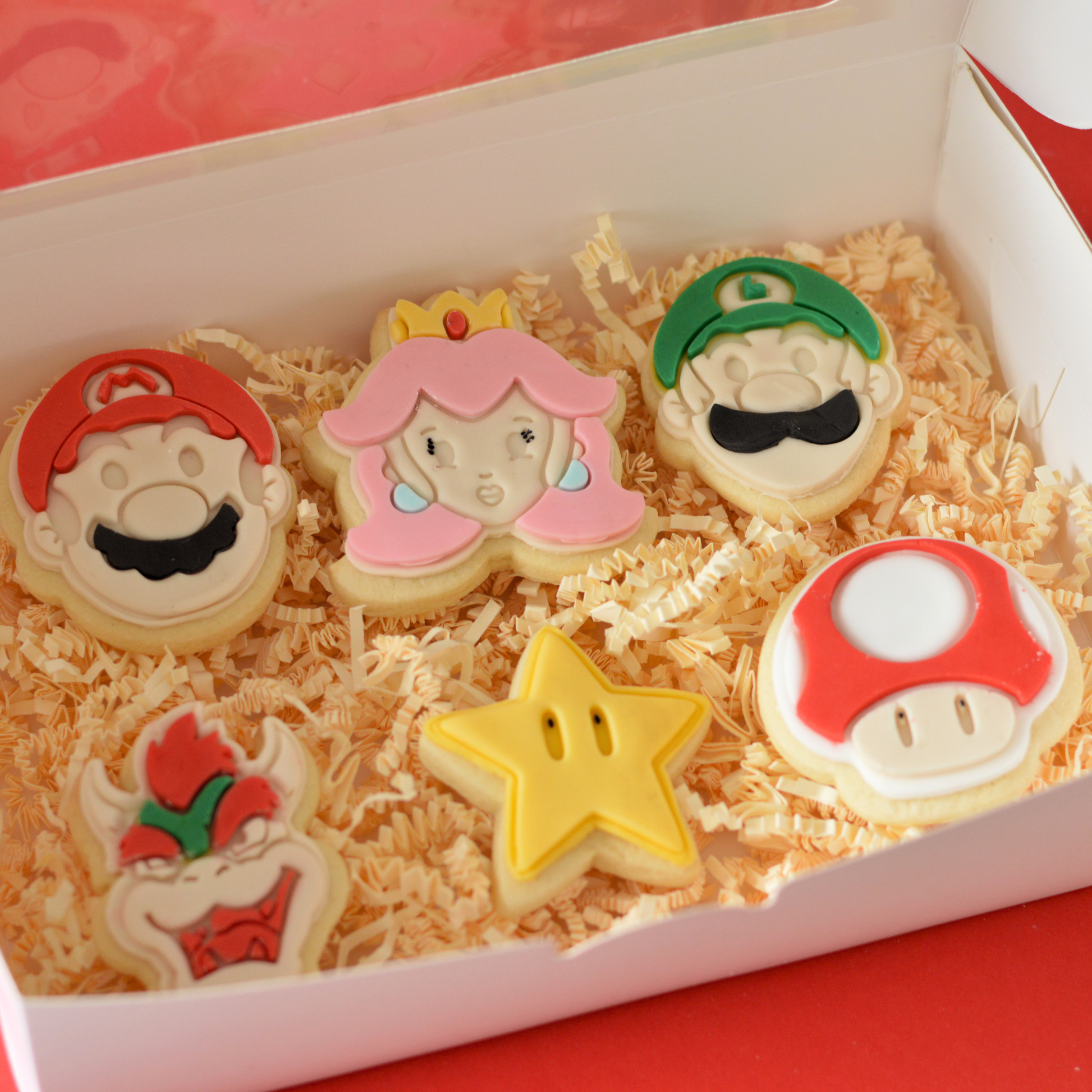 Super Mario themed fondant cookie gift box with six handmade character cookies by Oh Happy Co.