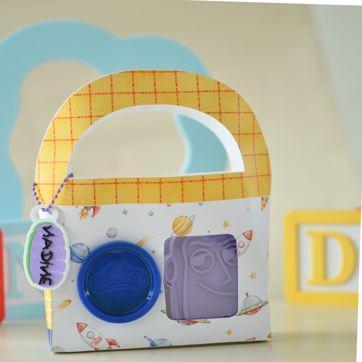 Play dough box with purple cutter and name tag