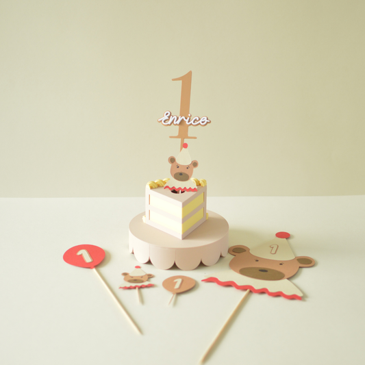 Number 1 cake topper with name on a birthday table with party decorations