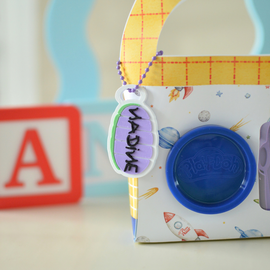 Name tag keychain on a play dough party favour box