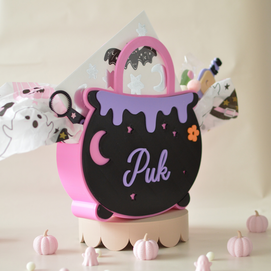 Pink and black cauldron treat box filled with sweets