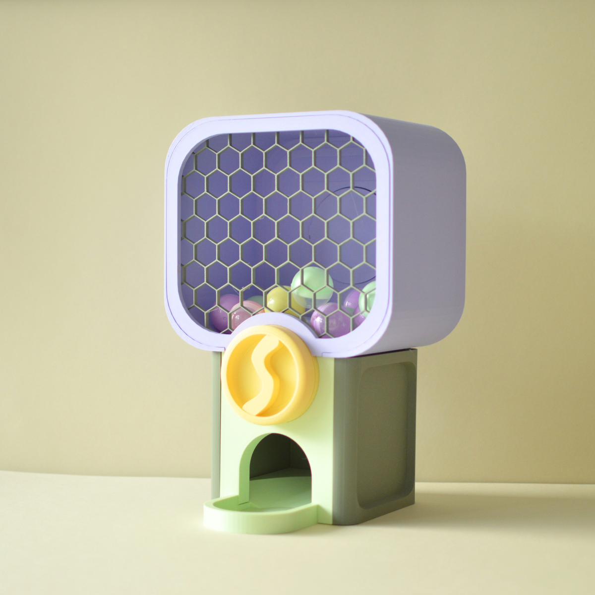 Front view of the mini surprise vending machine with honeycomb window and capsule tray