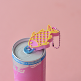 Fish shaped can opener keychain lifting the tab of a drink can