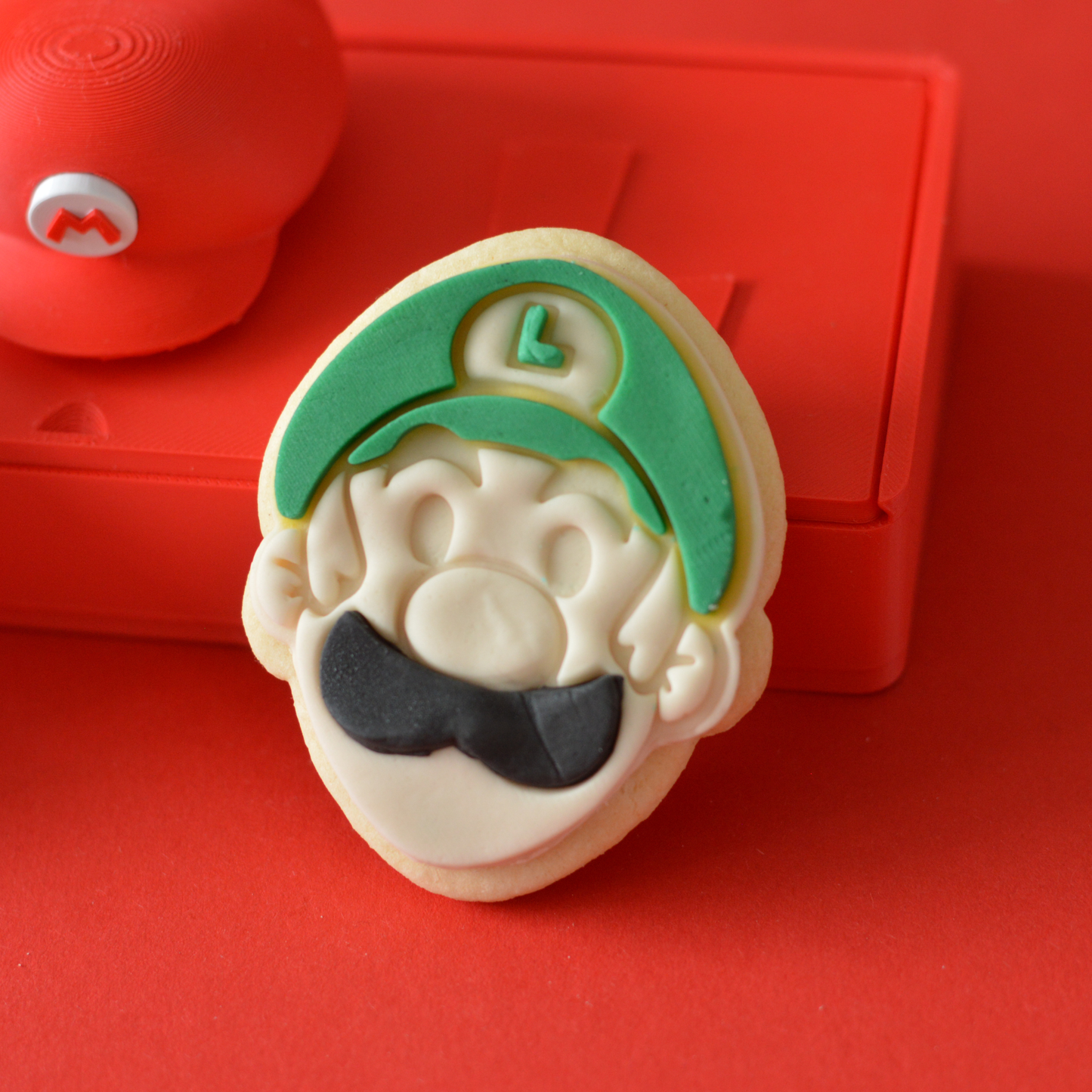 Mario and Luigi handmade fondant cookies close-up by Oh Happy Co.